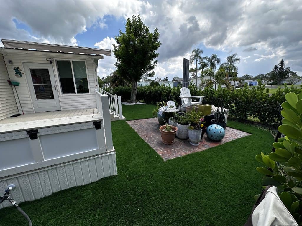 beautiful backyard with fake turf